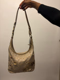 2012 Coach monogram hobo shoulder bag with a beige and gold floral appliqué design