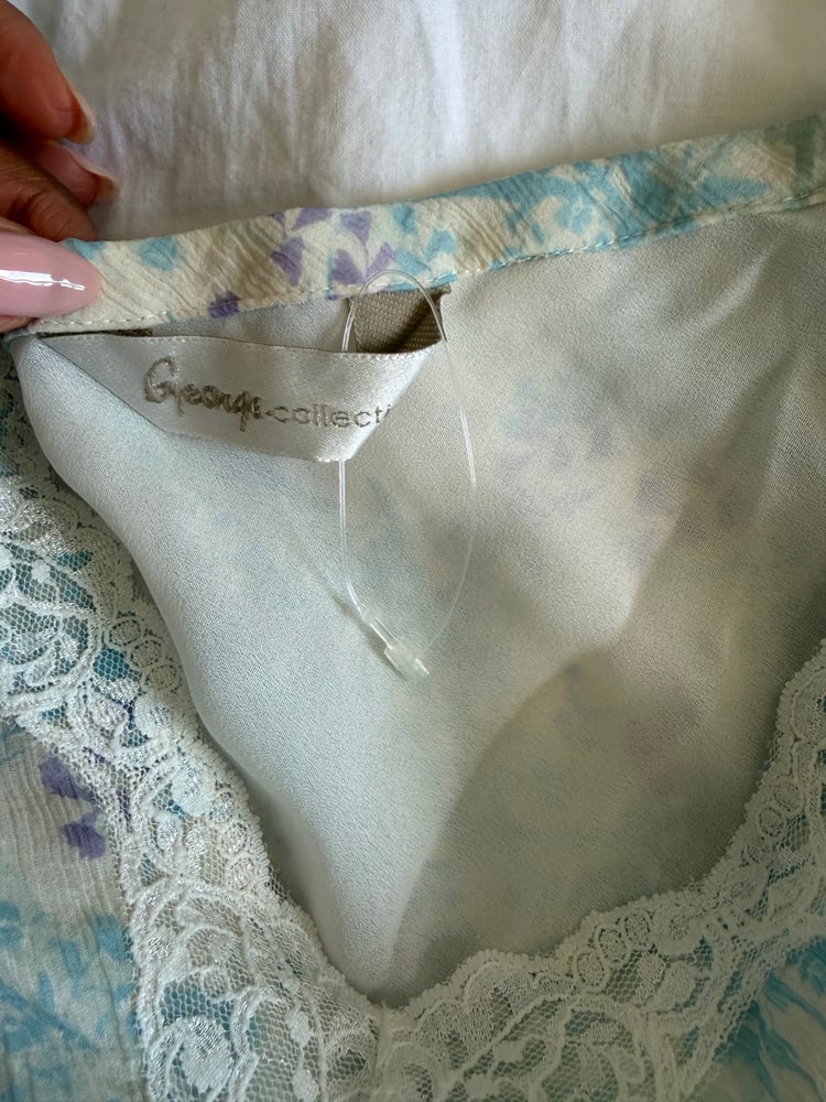 Vintage Y2K blue and white floral silk cami with asymmetrical hem and frilly straps