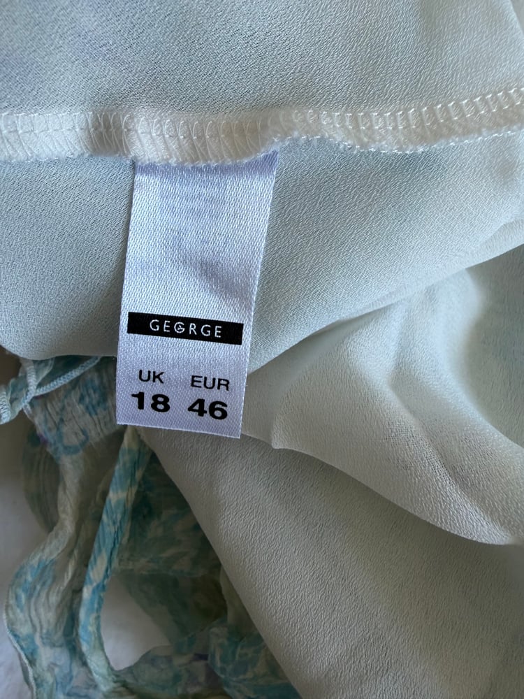 Vintage Y2K blue and white floral silk cami with asymmetrical hem and frilly straps