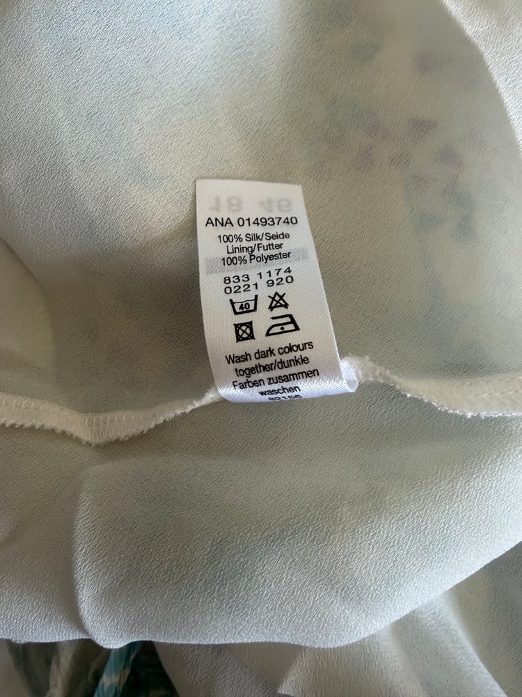 Vintage Y2K blue and white floral silk cami with asymmetrical hem and frilly straps