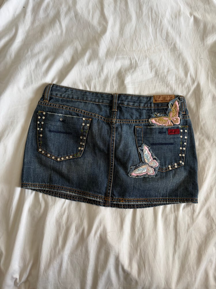 Vintage Y2K low rise denim mini skirt with butterfly appliqué
