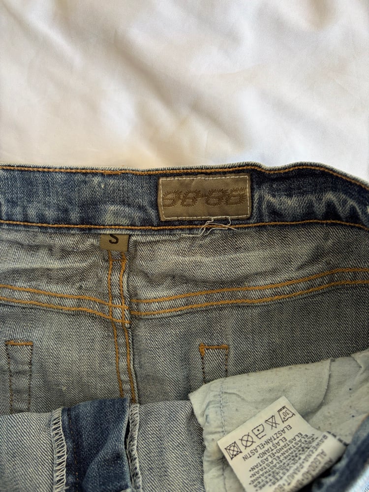 Vintage Y2K low waisted denim mini skirt with studs