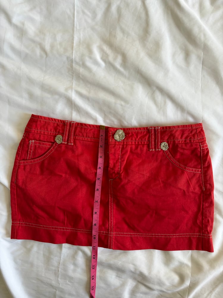 Vintage Y2K red denim belt skirt with white stitching and floral hardware