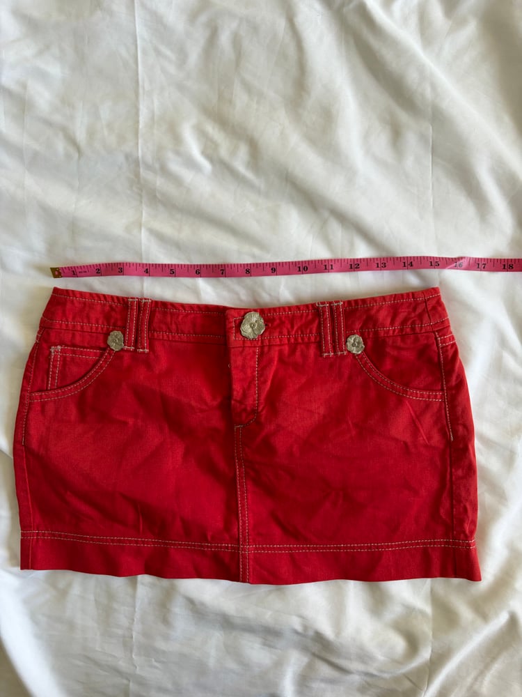 Vintage Y2K red denim belt skirt with white stitching and floral hardware