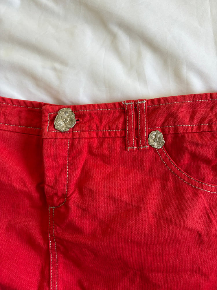 Vintage Y2K red denim belt skirt with white stitching and floral hardware