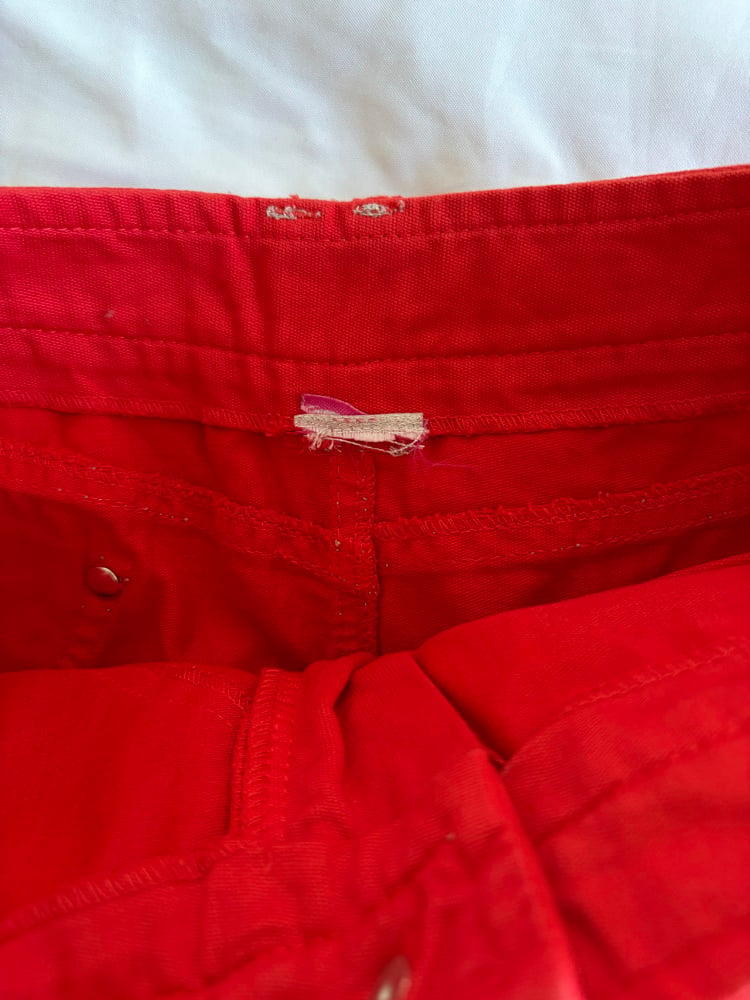 Vintage Y2K red denim belt skirt with white stitching and floral hardware
