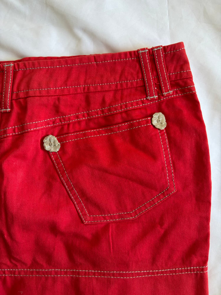 Vintage Y2K red denim belt skirt with white stitching and floral hardware