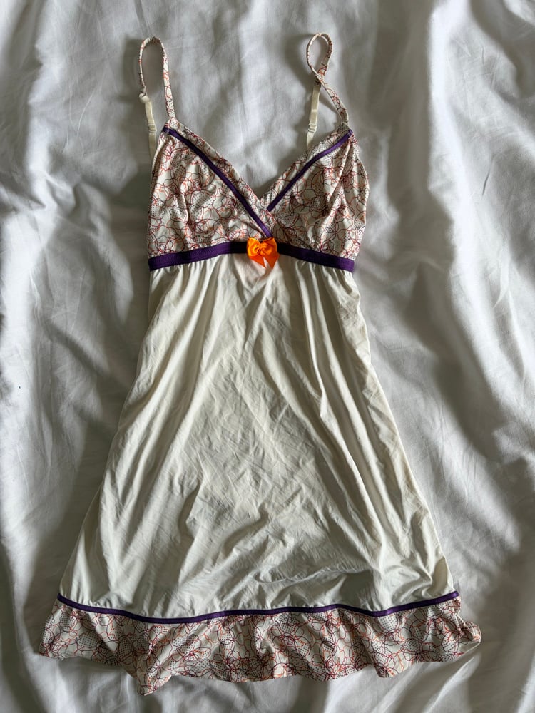 Vintage Y2K slip mini dress with orange and purple detailing and ruffle hem