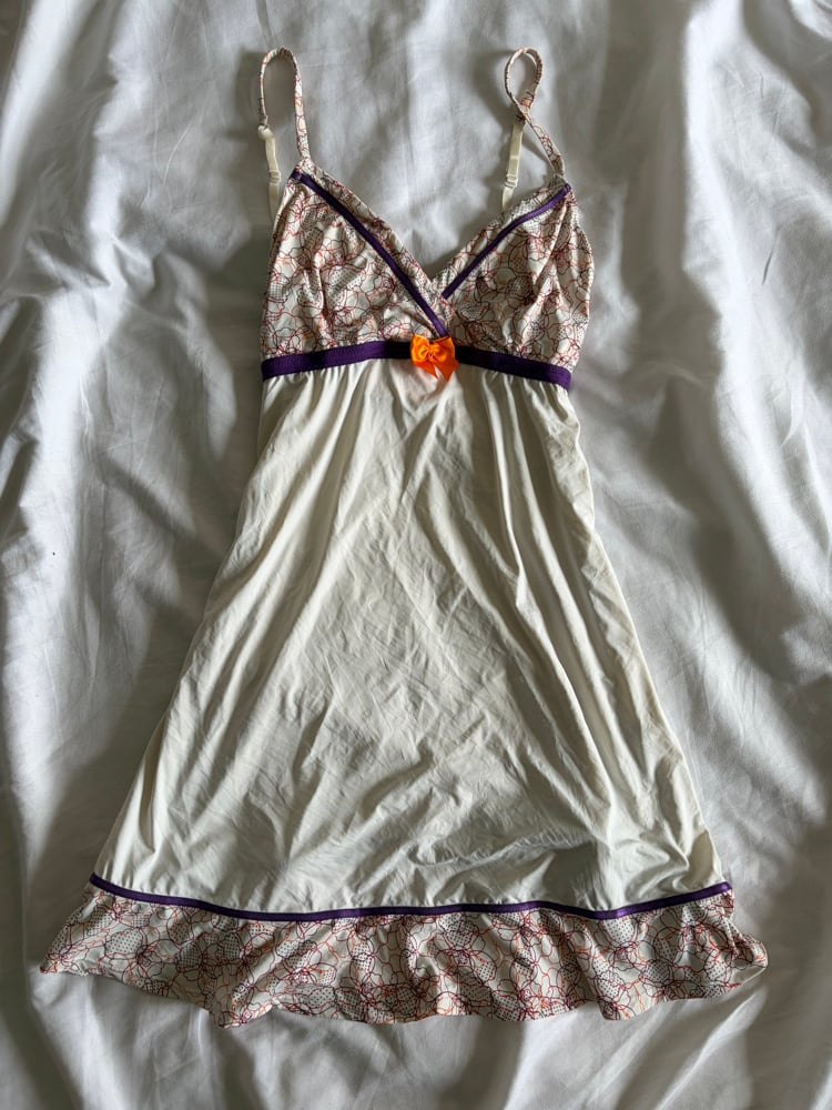 Vintage Y2K slip mini dress with orange and purple detailing and ruffle hem